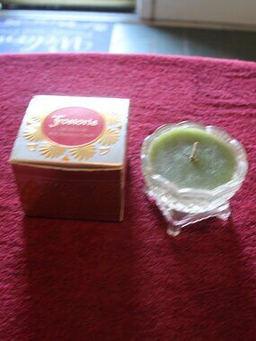 vintage Avon Fostoria glass salt cellar containing a green bayberry candle